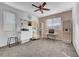 Bright home office space with two work stations, a chair, and a nice window view at 394 Red Feather Peak Ct, Las Vegas, NV 89138