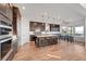 Modern kitchen features a large island with seating and stainless steel appliances at 394 Red Feather Peak Ct, Las Vegas, NV 89138