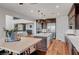 Open-concept kitchen with stainless steel appliances, island, and view to living room at 394 Red Feather Peak Ct, Las Vegas, NV 89138