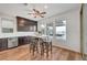 Bright eat-in kitchen features custom cabinets, wood floors, and a view of the backyard at 394 Red Feather Peak Ct, Las Vegas, NV 89138