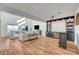 Bright and open living room features a built-in bar, hardwood floors, and abundant natural light at 394 Red Feather Peak Ct, Las Vegas, NV 89138