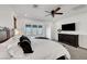 Bright main bedroom featuring a large window with beautiful views and modern furniture at 394 Red Feather Peak Ct, Las Vegas, NV 89138