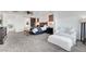 Open main bedroom layout with an ensuite bathroom, comfortable chair, and stylish decor at 394 Red Feather Peak Ct, Las Vegas, NV 89138