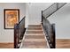 Carpeted staircase with modern railing, connecting different levels of the home at 394 Red Feather Peak Ct, Las Vegas, NV 89138