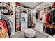 Spacious walk-in closet with custom shelving, drawers, and storage for clothes and accessories at 394 Red Feather Peak Ct, Las Vegas, NV 89138