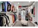 Well-organized walk-in closet with ample shelving, drawers, and rods for clothes and accessories at 394 Red Feather Peak Ct, Las Vegas, NV 89138
