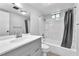 Updated bathroom featuring a vanity with sink, toilet, and tiled shower-tub combination at 3946 Torsby Pl # 3946, Las Vegas, NV 89119
