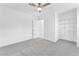 Spacious bedroom with neutral carpet, white walls, and a closet organizing system at 3946 Torsby Pl # 3946, Las Vegas, NV 89119
