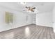 Large bonus room boasting wood-look flooring, a fan, and two windows at 3946 Torsby Pl # 3946, Las Vegas, NV 89119
