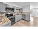 Stylish kitchen with grey cabinetry, stainless steel appliances, and modern countertops at 3946 Torsby Pl # 3946, Las Vegas, NV 89119