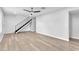 Spacious living room features wood-look flooring and a staircase leading to the upper level at 3946 Torsby Pl # 3946, Las Vegas, NV 89119