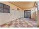 Cozy covered patio with tiled flooring and secure access doors at 3946 Torsby Pl # 3946, Las Vegas, NV 89119