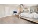Light and airy bedroom includes tv, ceiling fan, and neutral carpet flooring at 3986 Visby Ln, Las Vegas, NV 89119