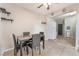 Cozy dining area with a table set for four, flowing into the kitchen space at 3986 Visby Ln, Las Vegas, NV 89119