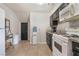 Functional kitchen with dark cabinetry, granite countertops, and modern appliances at 3986 Visby Ln, Las Vegas, NV 89119