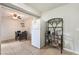 Bright kitchen featuring a white refrigerator and a practical wine rack, open to the dining area at 3986 Visby Ln, Las Vegas, NV 89119