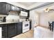 Well-maintained kitchen featuring granite countertops, black cabinets, and modern appliances at 3986 Visby Ln, Las Vegas, NV 89119