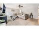 Bright living room with tile floors, a large sectional couch, and modern decor at 3986 Visby Ln, Las Vegas, NV 89119