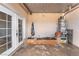 Enclosed patio area with double doors, water heater, and space for outdoor projects at 3986 Visby Ln, Las Vegas, NV 89119