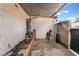Enclosed outdoor area with water heater, concrete patio, and potential garden space at 3986 Visby Ln, Las Vegas, NV 89119