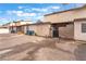 An exterior street view of a residential building with gravel and visible parking spaces at 3986 Visby Ln, Las Vegas, NV 89119
