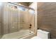 Bathroom featuring a tub with tile surround and a glass door at 4014 Trapani Pl, Las Vegas, NV 89141