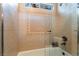 Elegant bathroom featuring decorative tile, a glass shower door, and modern fixtures at 4014 Trapani Pl, Las Vegas, NV 89141