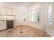 Bright dining area with tile floors, custom cabinetry, and large windows offering natural light at 4014 Trapani Pl, Las Vegas, NV 89141