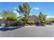 Lovely single-story home showcasing mature trees and desert landscaping, offering privacy and curb appeal at 4014 Trapani Pl, Las Vegas, NV 89141