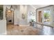 Grand foyer featuring tile floors, a detailed glass door, and decorative art pieces at 4014 Trapani Pl, Las Vegas, NV 89141