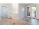 Welcoming foyer with decorative tile inlay, neutral walls, and a clear view to the chandelier in the hallway at 4014 Trapani Pl, Las Vegas, NV 89141