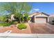 Charming single-story home with a well-manicured front yard and a spacious two-car garage at 4014 Trapani Pl, Las Vegas, NV 89141