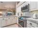 Beautifully designed kitchen with stainless steel appliances, granite countertops, and modern fixtures at 4014 Trapani Pl, Las Vegas, NV 89141