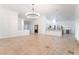 Open-concept living room featuring tile floors, recessed lighting, and bright white walls at 4014 Trapani Pl, Las Vegas, NV 89141
