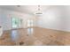 Spacious living room with tile floors, abundant natural light, and neutral decor; an ideal space for relaxation at 4014 Trapani Pl, Las Vegas, NV 89141