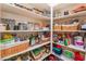 Well-stocked pantry with organized shelves containing an assortment of food and household items at 4014 Trapani Pl, Las Vegas, NV 89141