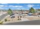 Aerial view of house with large lot, detached garage, pool and mountain views at 4414 E Baltimore Ave, Las Vegas, NV 89104