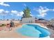 Backyard featuring a refreshing pool and ample space with a metal carport at 4414 E Baltimore Ave, Las Vegas, NV 89104