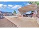 Backyard featuring a covered carport next to a lush pool and patio area at 4414 E Baltimore Ave, Las Vegas, NV 89104