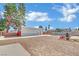 Wide shot of the spacious backyard featuring a pool and a metal carport at 4414 E Baltimore Ave, Las Vegas, NV 89104