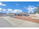 Expansive backyard with a pool, canopy, and a concrete area, perfect for outdoor activities at 4414 E Baltimore Ave, Las Vegas, NV 89104