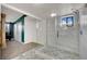 Stylish bathroom featuring a glass shower with gray and white tilework at 4414 E Baltimore Ave, Las Vegas, NV 89104