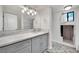 Updated bathroom features modern vanity with marble top, stylish fixtures, and a walk-in shower at 4414 E Baltimore Ave, Las Vegas, NV 89104