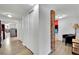 Bright hallway featuring modern floors, multiple closets, and access to the laundry room at 4414 E Baltimore Ave, Las Vegas, NV 89104