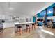 Stylish kitchen featuring bar seating, stainless appliances, and ample counter space for meal preparation at 4414 E Baltimore Ave, Las Vegas, NV 89104