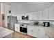 Bright kitchen features stainless appliances, white cabinets, and white marble countertops at 4414 E Baltimore Ave, Las Vegas, NV 89104