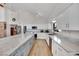 Spacious kitchen featuring white cabinets, an expansive island, and modern stainless steel appliances at 4414 E Baltimore Ave, Las Vegas, NV 89104