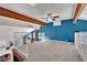 Spacious living room with wooden beams, a ceiling fan, and a view from the second floor at 4414 E Baltimore Ave, Las Vegas, NV 89104