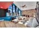 Bright living room with stone wall, fireplace, and large windows at 4414 E Baltimore Ave, Las Vegas, NV 89104