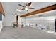 Large open-concept living room with unique architectural elements, ceiling fans, and natural light at 4414 E Baltimore Ave, Las Vegas, NV 89104